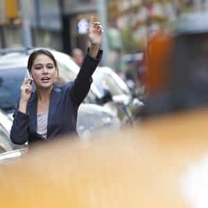 woman hailing a cab