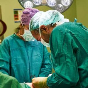 doctors performing surgery on small bowel