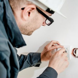 electrician working on outlet