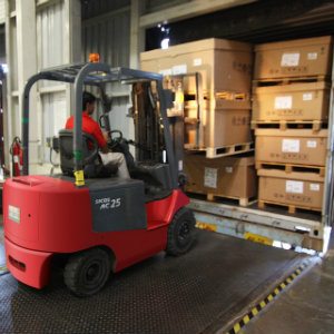 loading boxes in truck with forklift