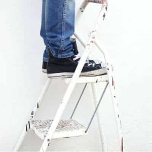 man standing on a ladder